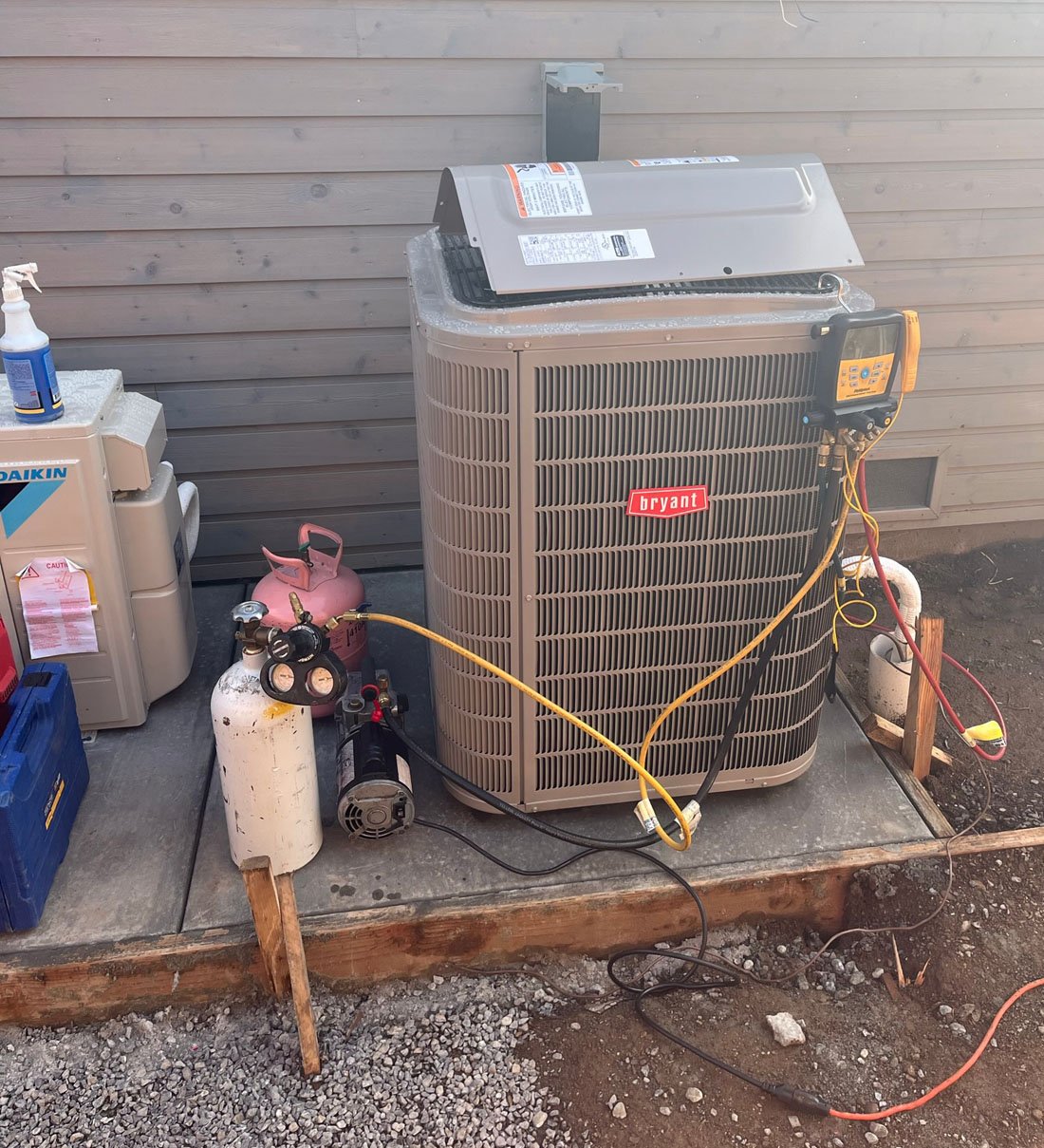 Menini HVAC technician on a service call