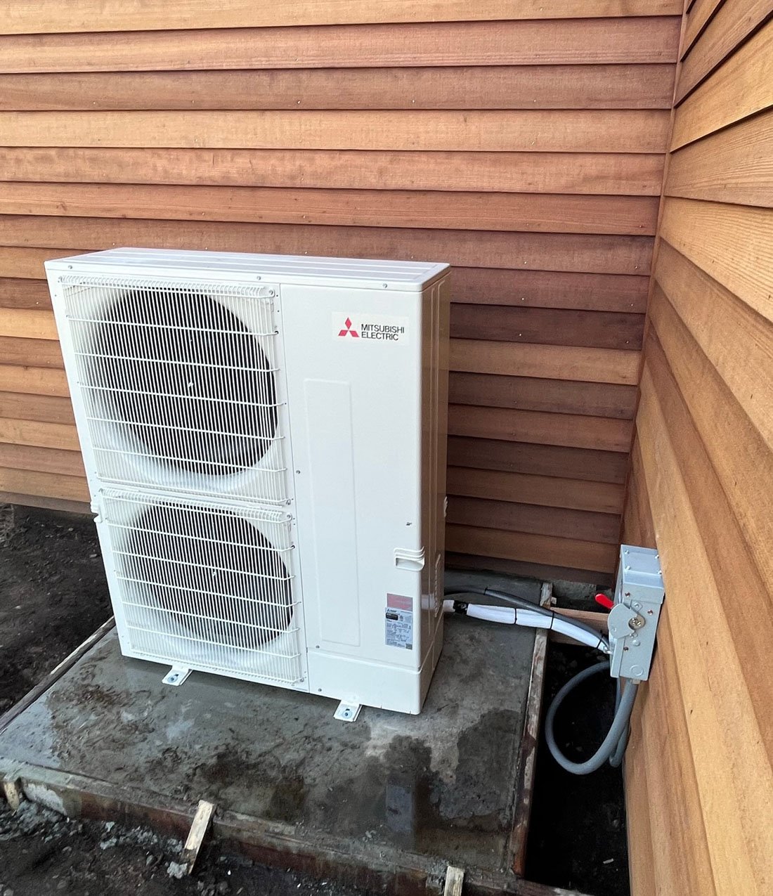 Menini HVAC Mitsubishi heat pump outdoor unit